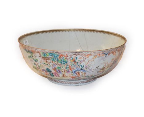 An 18th century Chinese porcelain punch bowl, decorated in polychrome enamels with Mandarin figures in landscapes over a blac