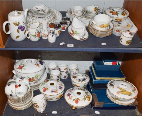 Two shelves of Royal Worcester Evesham pattern dinner and tea wares including tureens, egg coddlers, serving dishes (two shel