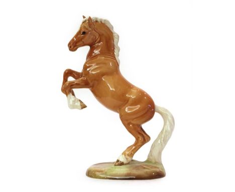 Beswick Welsh Cob (Rearing), first version, model No. 1014, palomino gloss (a.f) . Fine hair line / firing ? crack through ta