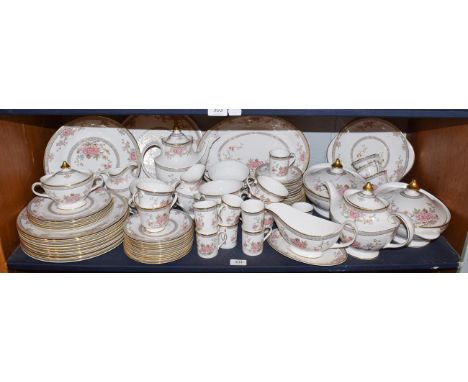 A Royal Doulton Canton pattern part dinner and tea service including a pair of tureens, sauce boat on stand and twelve dinner