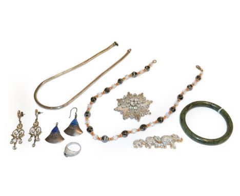 A small quantity of costume jewellery including a Butler &amp; Wilson elephant brooch, length 6.9cm, a paste set Jourdan broo