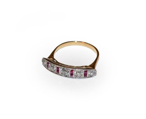A ruby and diamond ring, five old cut diamonds spaced by calibré cut rubies in white claw and millegrain settings, to a yello
