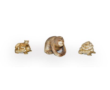 A Japanese Meji period netsuke as an orangutan, signed, a netsuke of a snake on a turtles back another of a horse on a turtle