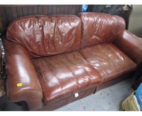 A Laura Ashley three seater brown leather sofa 