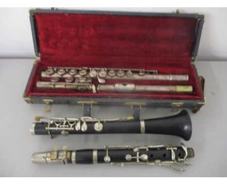 A Silvertone silver plated flute in a fitted case and a clarinet 