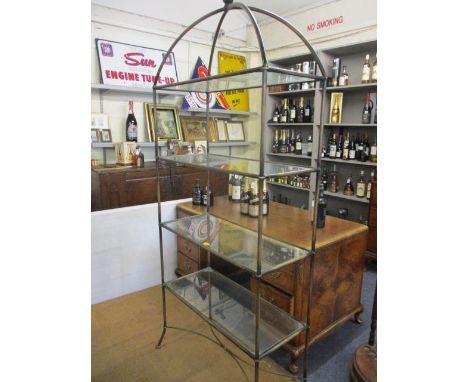 A contemporary metal shelf unit with four glass shelves, 78" x 32" x 14" 