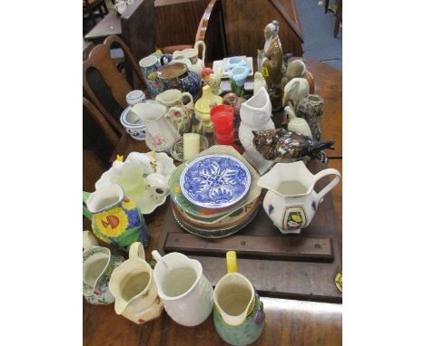 A late 20th century Goebel figural group of a boy and girl kissing, together with other figures and models of birds, mixed ce