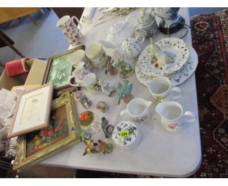 A mixed lot to include a pencil sketch, a print and an oil depicting flowers, along with a quantity of ceramics to include Po
