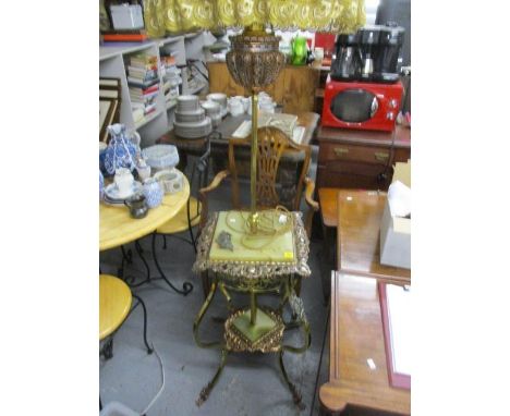 A 20th century onyx and brass standard lamp having an ornate, pierced frame, 63" h 