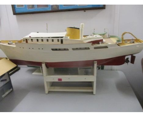 A painted plastic, metal and wooden model boat, partly completed 