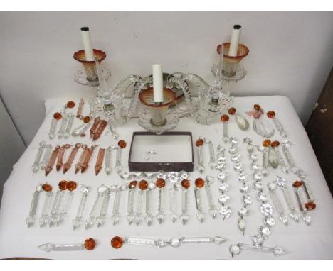 A Venetian style clear and amber coloured glass wall light, with three scrolled branches for lights and a pair of scrolled br