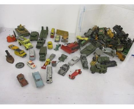 A quantity of die cast and tin plate toy vehicles to include Dinky Army vehicles and American cars 