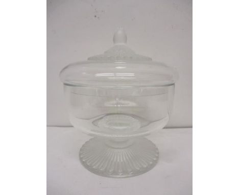 A Lalique frosted and clear glass lidded jar, with an ovoid finial and fluted ornaments, on a splayed foot with an etched sig
