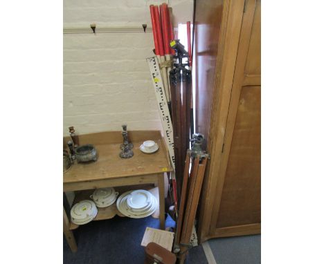 Two surveyors levels to include a Stanley, London wooden cased level, serial number 39588, with wooden tripod stand, a leathe