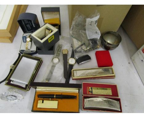 A mixed lot of wristwatches to include a Kenneth Cole reaction wristwatch, a WIN International ball point pen and lighter set