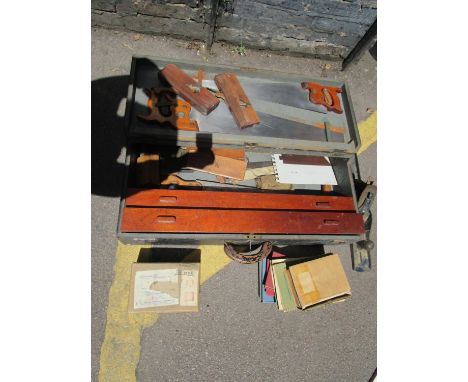 An early 20th century wooden apprentice carpenters tool box, with key, containing various carpentry tools to include saws, re