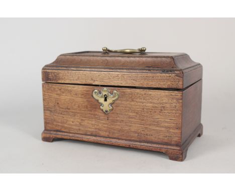A late 18th Century Chippendale style three division mahogany tea caddy with original metal canisters, brass handle and escut