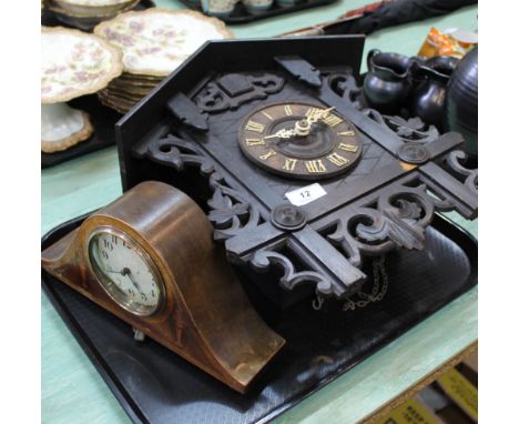 A Swiss carved wooden cuckoo clock plus a small inlaid mantel clock