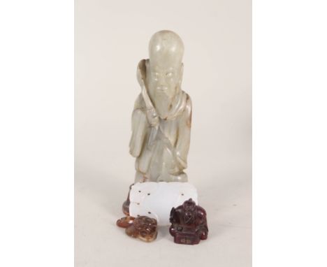 A group of four Chinese carvings including Jade items