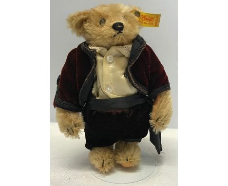 Steiff ring teddy bear, No 0155/23 dressed in Red Velvet top, brown trousers, 23cms tall.