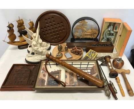 An assorted collection to include Solitaire and cribbage boards, ornaments, cork picture, diorama, figurines, horn ship, trun