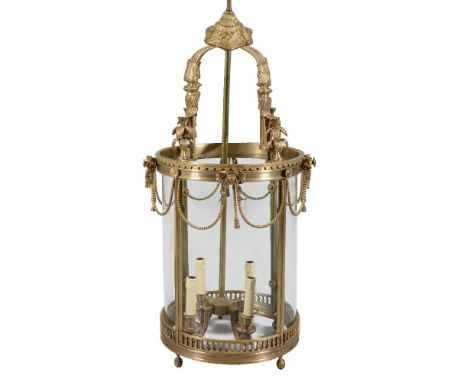 A substantial gilt metal and glazed four light hall lantern in Regency taste, mid 20th century, the four scrolled ceiling sup