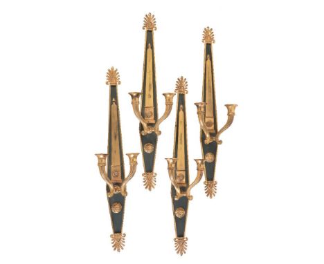 A set of four parcel gilt and painted metal twin light wall appliques in Empire taste, second half 20th century, the cornucop