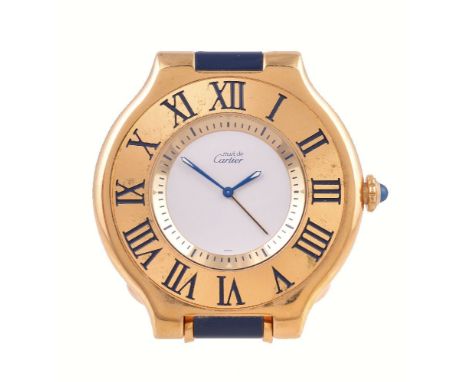 Cartier, Must de Cartier, a gilt metal travel alarm clock, quartz alarm movement, white dial, Roman numeral chapter ring to t