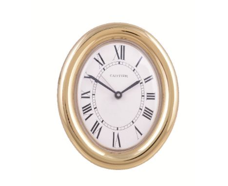 Cartier, a gilt metal travel alarm clock, no. 890813034, quartz alarm movement, white dial, Roman numerals, sword hands, cent