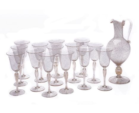 A modern Murano clear and gilt part table service, crosshatched with adventurine lattice, comprising: a ewer with a clear gla