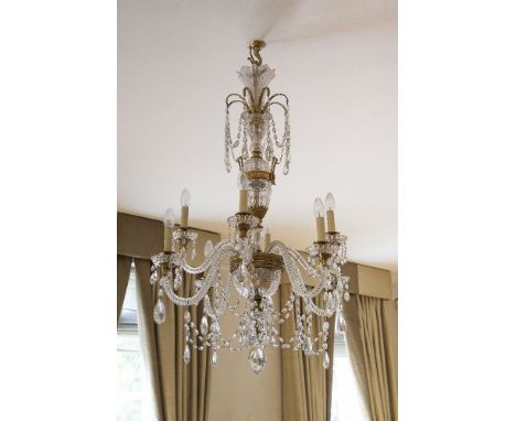 A pair of cut glass and gilt metal mounted eight light chandeliers in late 18th century taste, 20th century, the scalloped sc