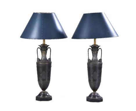 A pair of French patinated metal oil lamp bases in Neoclassical taste, circa 1875, modelled as vases, the flared and lobed ne