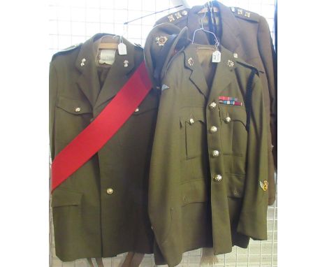 Group of British Army uniforms to include; jackets, shirts, trousers and other items, different ranks and regiments, together