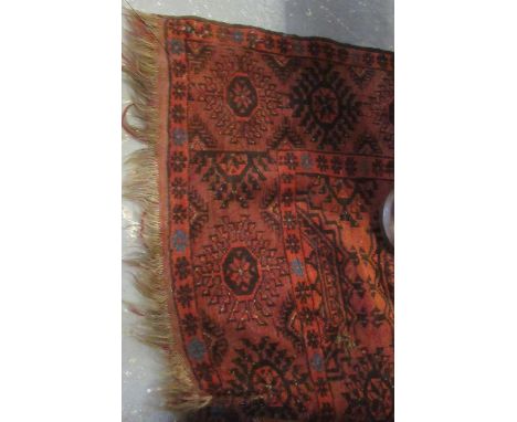 Distressed Middle Eastern design brown and orange ground geometric floral and foliate carpet. (B.P. 21% + VAT) 