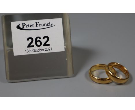 Two 22ct gold wedding rings.  Ring size P and K.  Approx weight 13.1 grams. 