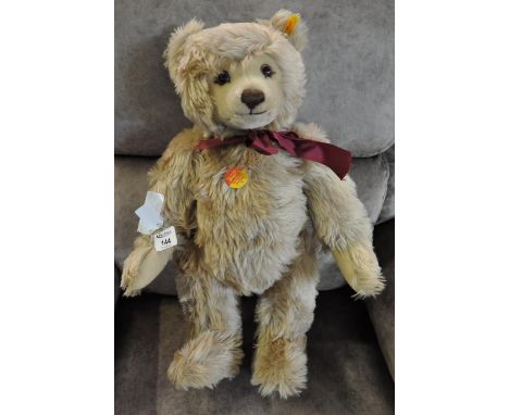 Steiff light golden brown teddy bear with burgundy bow.(B.P. 21% + VAT) 