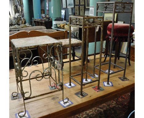 Weathered wrought iron scroll decorated garden plant stand on square base, together with two modern metal plant stands (missi