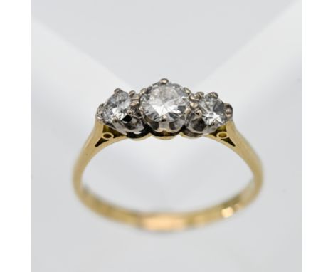 A diamond three stone ring, set in 18ct yellow gold, size R.