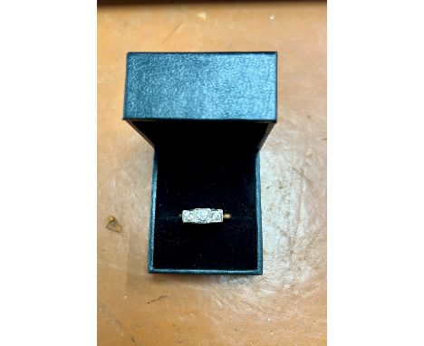 A three stone diamond ring, old cut diamonds in square frames, set in yellow gold, size R/S.