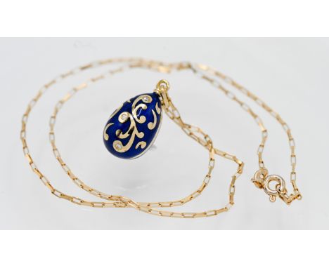Fabergé, an 18ct gold and enamelled egg pendant set with diamonds, from a limited edition stamped on the pendant 138/1000, se