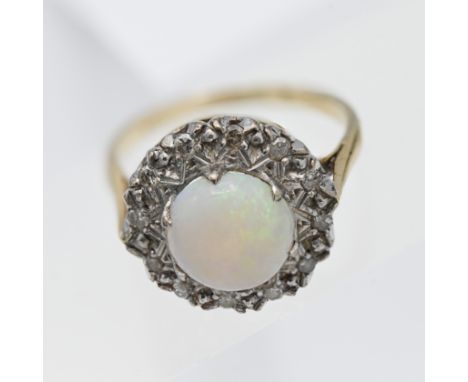 A large opal and diamond cluster ring, set in 18ct yellow gold, size O.