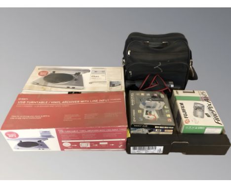 A boxed Ion USB turntable and a further box containing Fujifilm and other cameras, video camera, camera bag, etc.