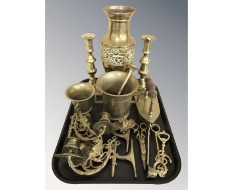 A pair of brass candlesticks, mortar and pestle, vase, pair of candle sconces in the form of griffons, etc.