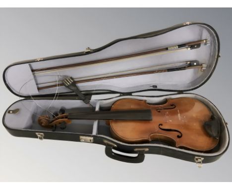A 20th century violin with two piece 15" back, in case with two bows. (as found)
