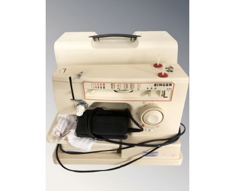 A Singer 6120 electric sewing machine, with lead and paddle. (continental plug)
