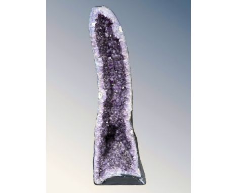 A very large and impressive amethyst geode specimen, 127 cm H x 44 cm W x 36 cm D, approximately 135 kg. 