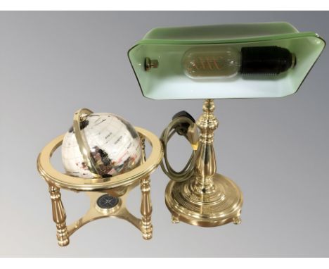 A reproduction brass banker's style desk lamp, height 40 cm, and a gemstone globe.