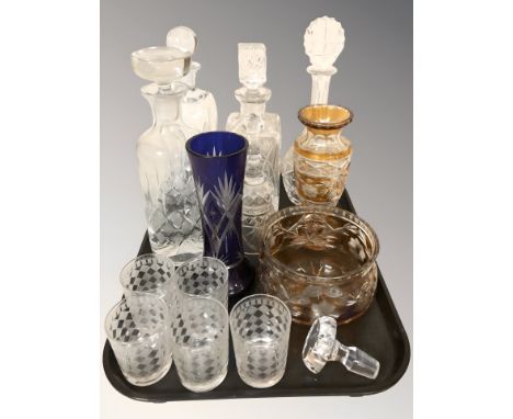 A group of glass decanters, amber flash cut vase and similar bowl, further blue flash cut vase, five tumblers.