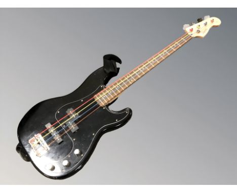 A Squier by Fender precision bass guitar.