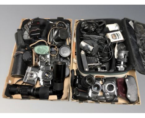 A collection of vintage and modern cameras including Olympus, Nikon, various lenses, camera bags, etc. (2 boxes)
